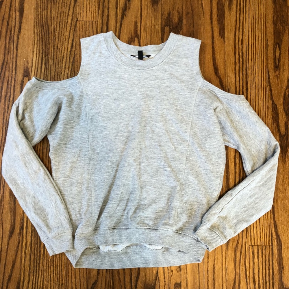 Gray long sleeve sweater with shoulder cut outs.